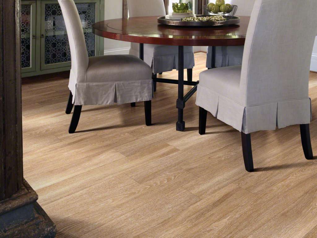 Dining room with light oak-look vinyl plank flooring